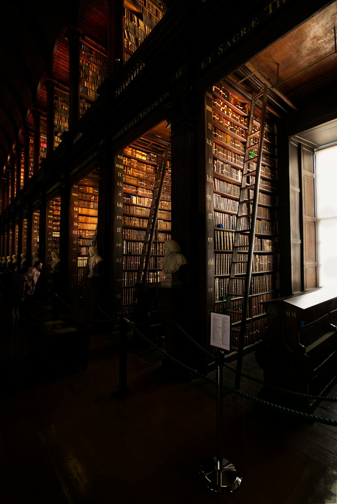 Old library with tall shelves full of books